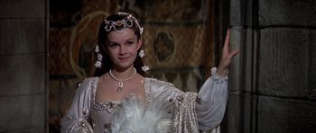Movie still from “Anne of the Thousand Days” (1969), directed by Charles Jarrott – A beautiful young lady wearing a white dress; Medium shot, Over the shoulder angle