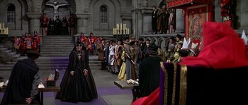 Movie still from “Anne of the Thousand Days” (1969), directed by Charles Jarrott – A group of people standing in front of a building; Wide shot, High angle