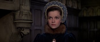 Movie still from “Anne of the Thousand Days” (1969), directed by Charles Jarrott – A person wearing a hat; Close Up shot, Over the shoulder angle