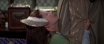 Movie still from “Anne of the Thousand Days” (1969), directed by Charles Jarrott – A woman wearing a headdress is looking up at the sky; Close Up shot, Over the shoulder angle
