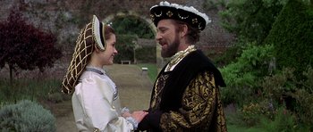 Movie still from “Anne of the Thousand Days” (1969), directed by Charles Jarrott – A man and a woman dressed in medieval clothing; Medium shot, Over the shoulder angle