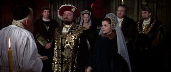Movie still from “Anne of the Thousand Days” (1969), directed by Charles Jarrott – A group of people dressed in medieval costumes; Medium shot, Over the shoulder angle