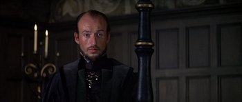 Movie still from “Anne of the Thousand Days” (1969), directed by Charles Jarrott – A person wearing a suit and tie; Close Up shot, Low angle