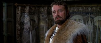 Movie still from “Anne of the Thousand Days” (1969), directed by Charles Jarrott – A man with a beard wearing a fur coat; Close Up shot, Low angle
