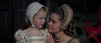 Movie still from “Anne of the Thousand Days” (1969), directed by Charles Jarrott – A woman and a little girl in a renaissance costume; Close Up shot, Over the shoulder angle