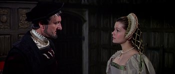 Movie still from “Anne of the Thousand Days” (1969), directed by Charles Jarrott – A man and a woman are talking to each other; Medium shot, Over the shoulder angle