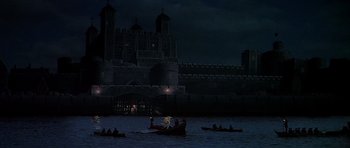 Movie still from “Anne of the Thousand Days” (1969), directed by Charles Jarrott – People in canoes in front of a castle at night; Extreme Wide shot, High angle