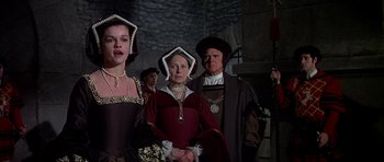 Movie still from “Anne of the Thousand Days” (1969), directed by Charles Jarrott – A group of people dressed in medieval costumes; Medium shot, High angle