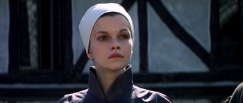 Movie still from “Anne of the Thousand Days” (1969), directed by Charles Jarrott – A woman wearing a white hat and a black jacket; Close Up shot, Low angle