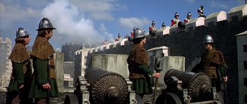 Movie still from “Anne of the Thousand Days” (1969), directed by Charles Jarrott – A man wearing a helmet and holding a sword; Extreme Wide shot, Low angle