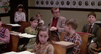 Movie still from “Annie Hall” (1977), directed by Woody Allen – A group of children sitting at desks in a class room; Medium shot, Over the shoulder angle