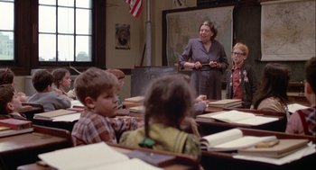 Movie still from “Annie Hall” (1977), directed by Woody Allen – A woman standing in front of a group of children; Medium shot, Over the shoulder angle