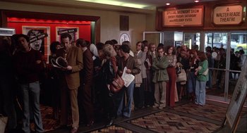 Movie still from “Annie Hall” (1977), directed by Woody Allen – A group of people standing in line at a movie theater; Wide shot, High angle