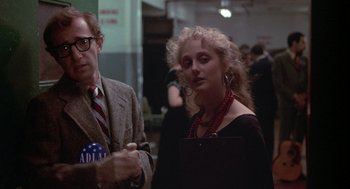 Movie still from “Annie Hall” (1977), directed by Woody Allen – A man and a woman standing next to each other; Medium shot, Over the shoulder angle
