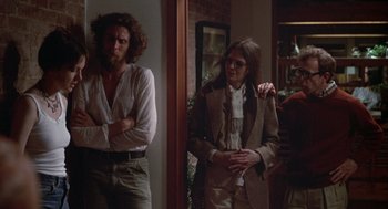 Movie still from “Annie Hall” (1977), directed by Woody Allen – A man and a woman standing next to each other in a room; Medium shot, Over the shoulder angle