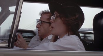 Movie still from “Annie Hall” (1977), directed by Woody Allen – A man and a woman driving a car; Close Up shot, Low angle