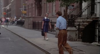 Movie still from “Annie Hall” (1977), directed by Woody Allen – A man and a woman walking down the sidewalk; Wide shot, Over the shoulder angle