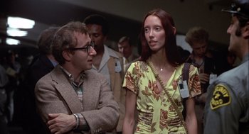 Movie still from “Annie Hall” (1977), directed by Woody Allen – A man and a woman standing next to each other; Medium shot, Over the shoulder angle