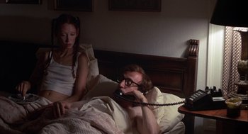 Movie still from “Annie Hall” (1977), directed by Woody Allen – A man and a woman sitting in a bed; Medium shot, High angle