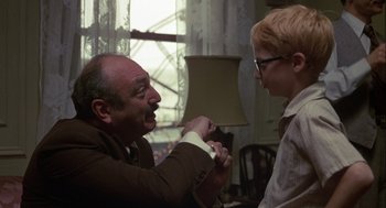 Movie still from “Annie Hall” (1977), directed by Woody Allen – An older man and a younger woman are playing a video game; Medium shot, Over the shoulder angle