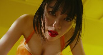 Movie still from “Antiporno” (2016), directed by Sion Sono – A person wearing a bra; Extreme Close Up shot, Low angle