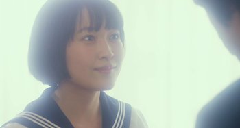 Movie still from “Antiporno” (2016), directed by Sion Sono – A young asian woman in a sailor's uniform; Close Up shot, Low angle
