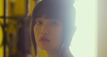 Movie still from “Antiporno” (2016), directed by Sion Sono – A young woman's face in the sunlight; Close Up shot, Low angle