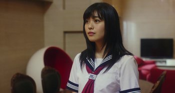 Movie still from “Antiporno” (2016), directed by Sion Sono – A young asian girl in a school uniform; Close Up shot, Low angle