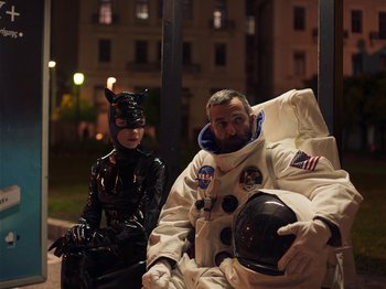 A man and a woman dressed up in costumes