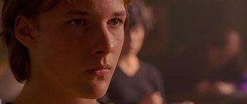 Movie still from “Apt Pupil” (1998), directed by Bryan Singer – A young woman's face; Close Up shot, Over the shoulder angle