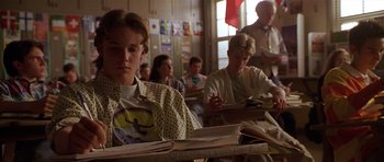Movie still from “Apt Pupil” (1998), directed by Bryan Singer – A group of people sitting in a classroom; Medium shot, Over the shoulder angle