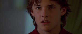 Movie still from “Apt Pupil” (1998), directed by Bryan Singer – A young man's face; Close Up shot, Low angle