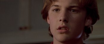 Movie still from “Apt Pupil” (1998), directed by Bryan Singer – A young man's face; Close Up shot, Low angle