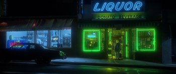 Movie still from “Apt Pupil” (1998), directed by Bryan Singer – Two people standing in front of a liquor store at night; Extreme Wide shot, High angle