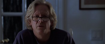 Movie still from “Apt Pupil” (1998), directed by Bryan Singer – An older man wearing glasses looking at the camera; Close Up shot, Over the shoulder angle