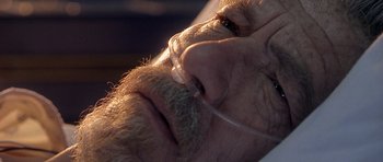 Movie still from “Apt Pupil” (1998), directed by Bryan Singer – An old man with a beard and a mustache; Extreme Close Up shot, High angle