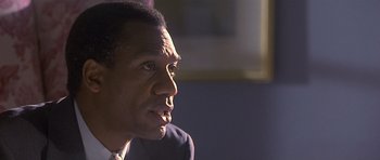 Movie still from “Apt Pupil” (1998), directed by Bryan Singer – A person looking at the camera; Close Up shot, Over the shoulder angle