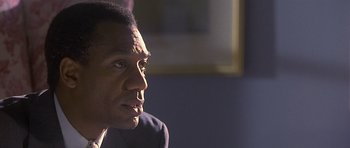 Movie still from “Apt Pupil” (1998), directed by Bryan Singer – A person looking at something; Close Up shot, Over the shoulder angle