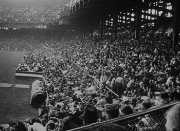 Movie still from “Arsenic and Old Lace” (1944), directed by Frank Capra – An old photo of a baseball game in progress; Extreme Wide shot, High angle