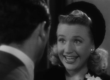 Movie still from “Arsenic and Old Lace” (1944), directed by Frank Capra – An old black and white photo of a woman and a man; Close Up shot, Over the shoulder angle