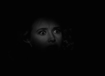 Movie still from “Arsenic and Old Lace” (1944), directed by Frank Capra – A woman with her eyes wide open in the dark; Close Up shot, High angle