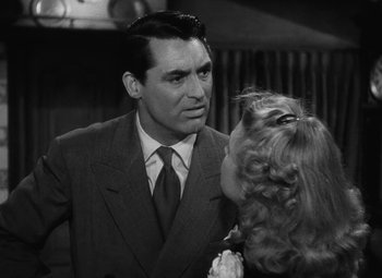 Movie still from “Arsenic and Old Lace” (1944), directed by Frank Capra – A man and a woman in a black and white photo; Close Up shot, Over the shoulder angle