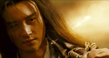 Movie still from “Ashes of Time” (1994), directed by Kar-Wai Wong – A person with long hair; Close Up shot, Low angle