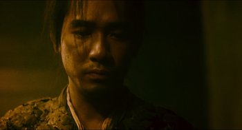 Movie still from “Ashes of Time” (1994), directed by Kar-Wai Wong – A man in a dark room looking at the camera; Close Up shot, Low angle