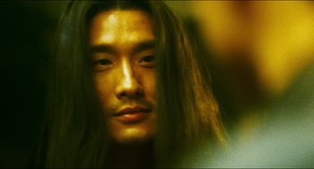 Movie still from “Ashes of Time” (1994), directed by Kar-Wai Wong – A person with long hair; Close Up shot, Over the shoulder angle
