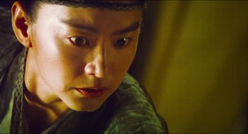 Movie still from “Ashes of Time” (1994), directed by Kar-Wai Wong – A person's face in a room; Close Up shot, Low angle