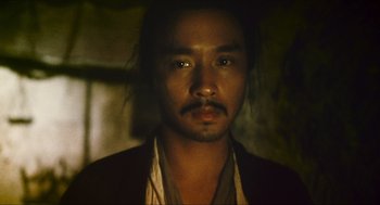 Movie still from “Ashes of Time” (1994), directed by Kar-Wai Wong – A person with a beard; Close Up shot, Low angle