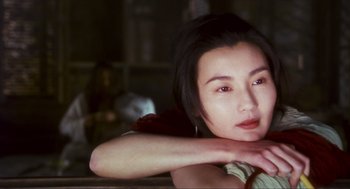 Movie still from “Ashes of Time” (1994), directed by Kar-Wai Wong – A person sitting in front of a window; Close Up shot, Over the shoulder angle