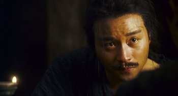 Movie still from “Ashes of Time” (1994), directed by Kar-Wai Wong – A person with a beard; Close Up shot, Over the shoulder angle