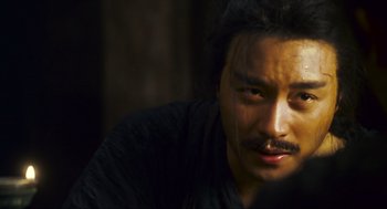 Movie still from “Ashes of Time” (1994), directed by Kar-Wai Wong – A person with a mustache; Close Up shot, Over the shoulder angle